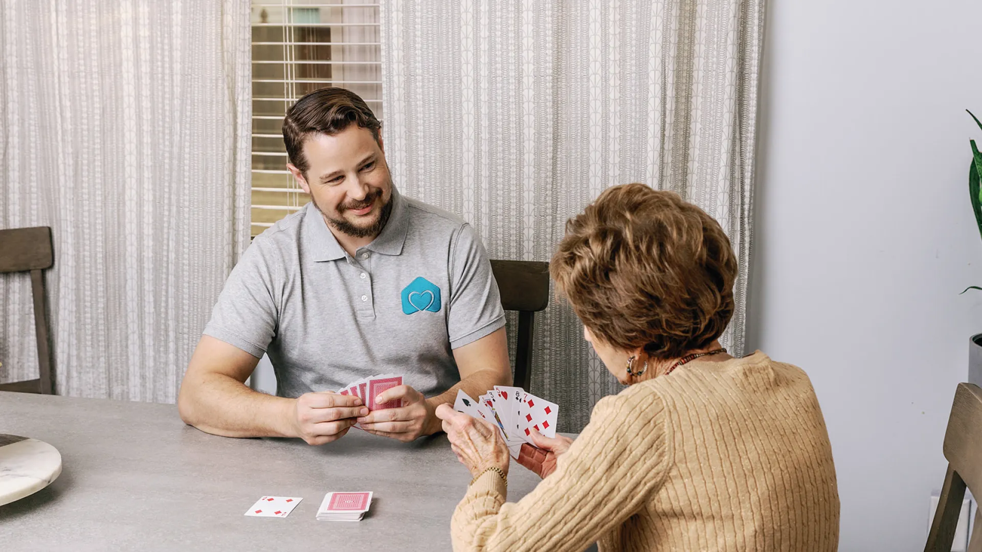 a man and a woman playing cards