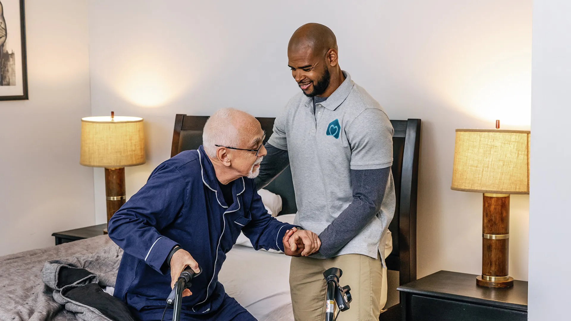 a man in a wheelchair being helped by another man