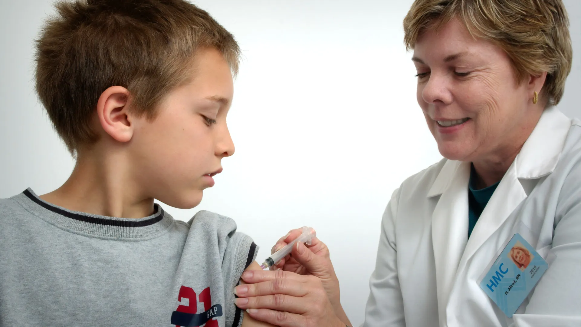 a man and a young boy looking at the camera