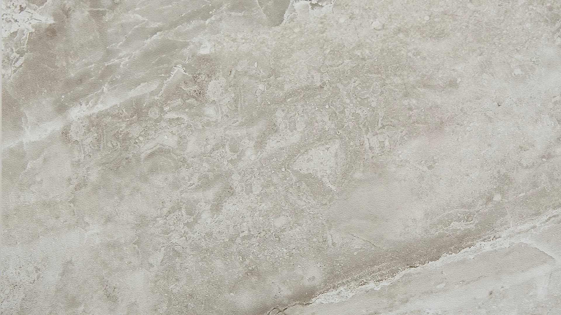 Beige and light gray textured marble surface with natural veins and subtle color variations.