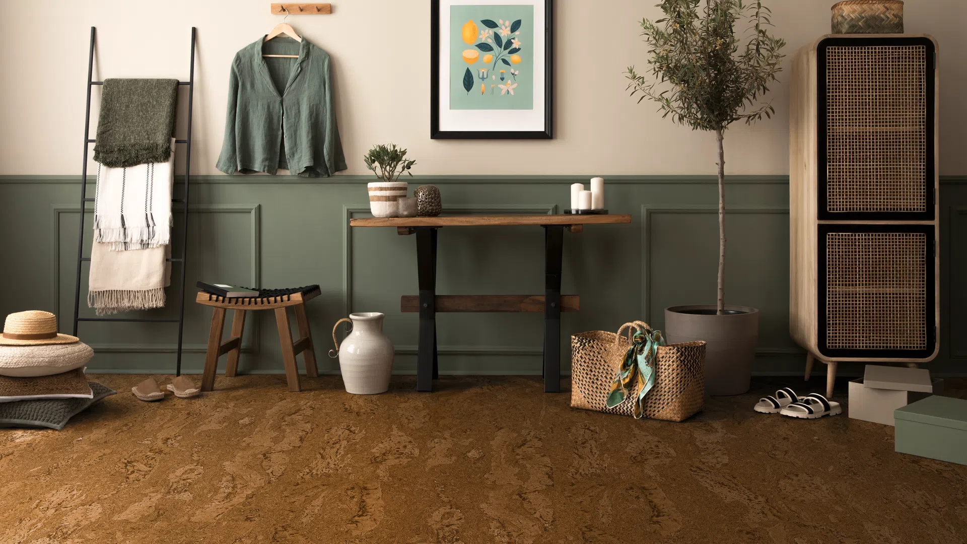 Cozy living space with green paneled wall, wooden furniture, plants, woven decor, and neutral accessories.