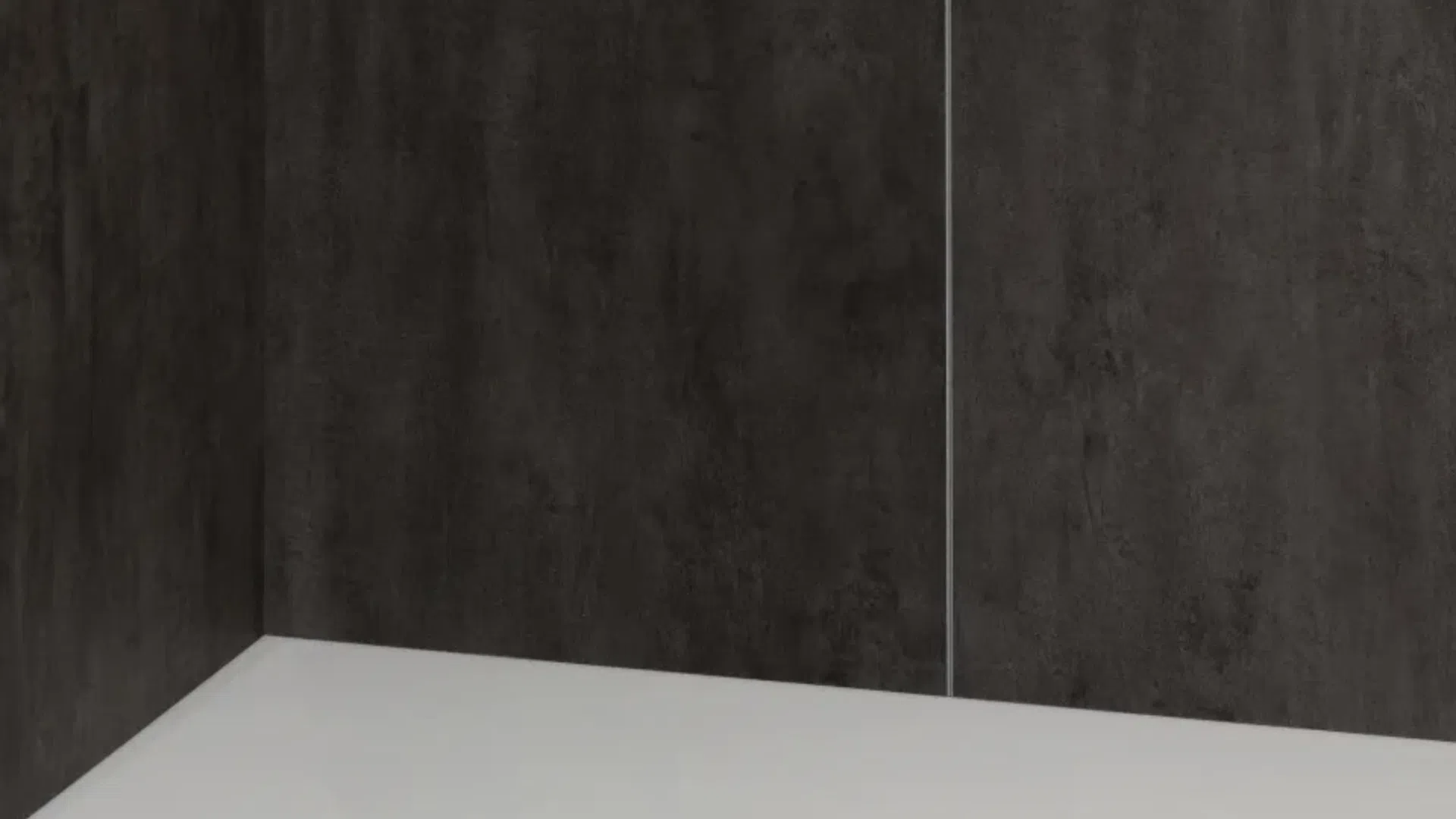 Modern shower corner with dark textured walls and a white base featuring a circular drain. w
