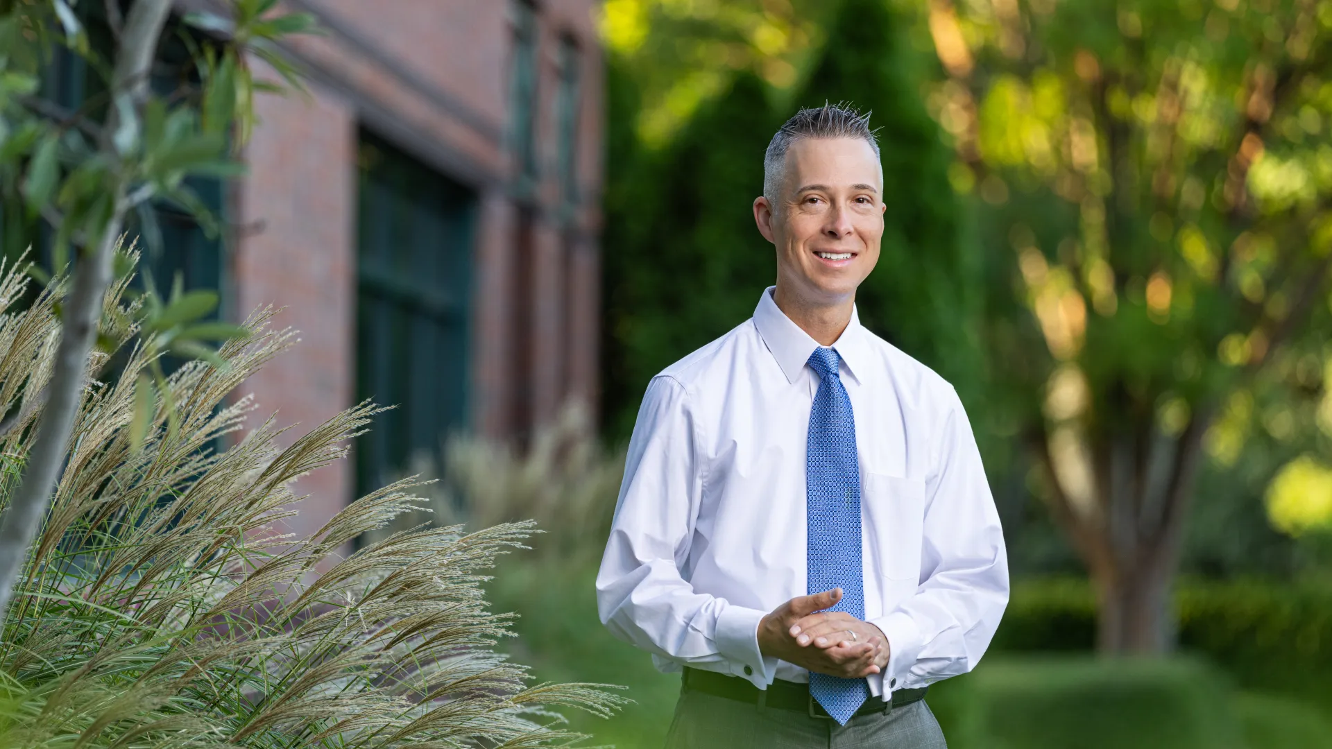 a man in a white shirt and blue tie