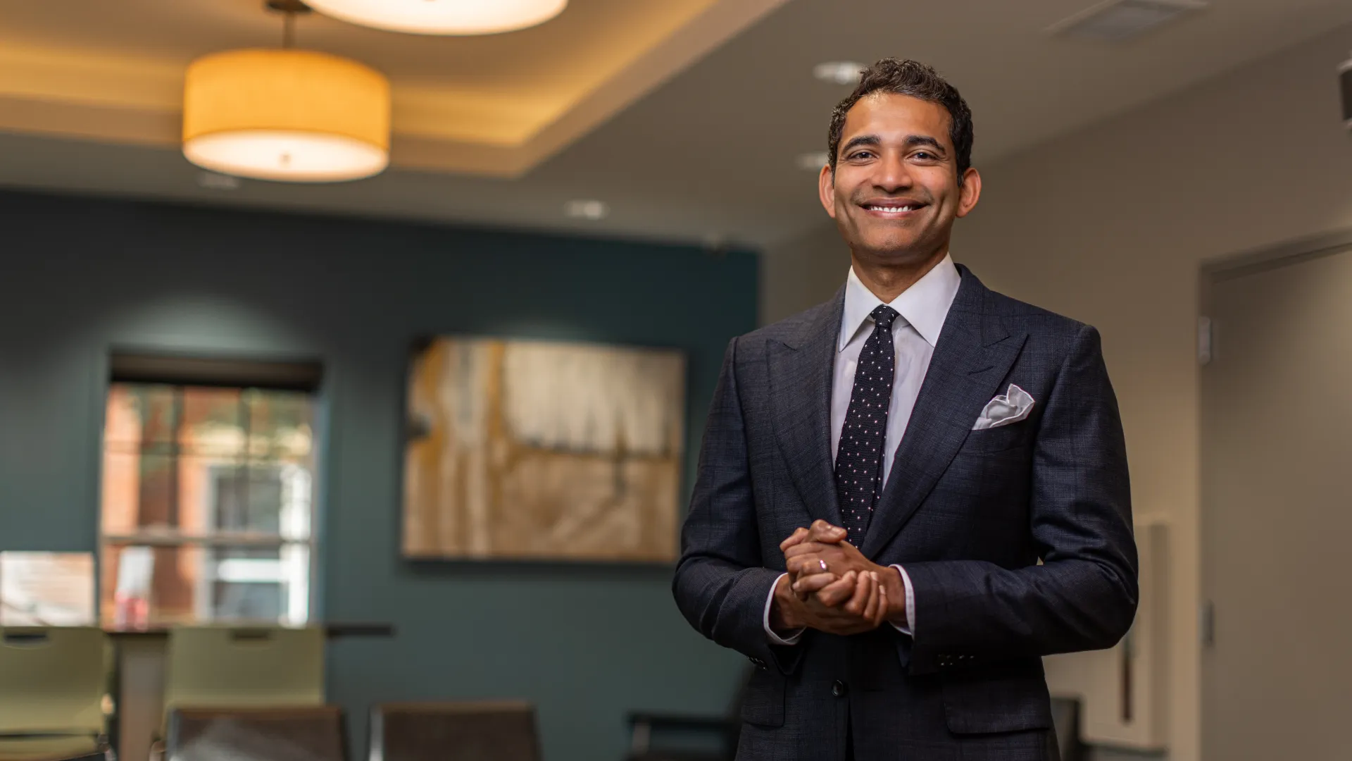 a man in a suit smiling