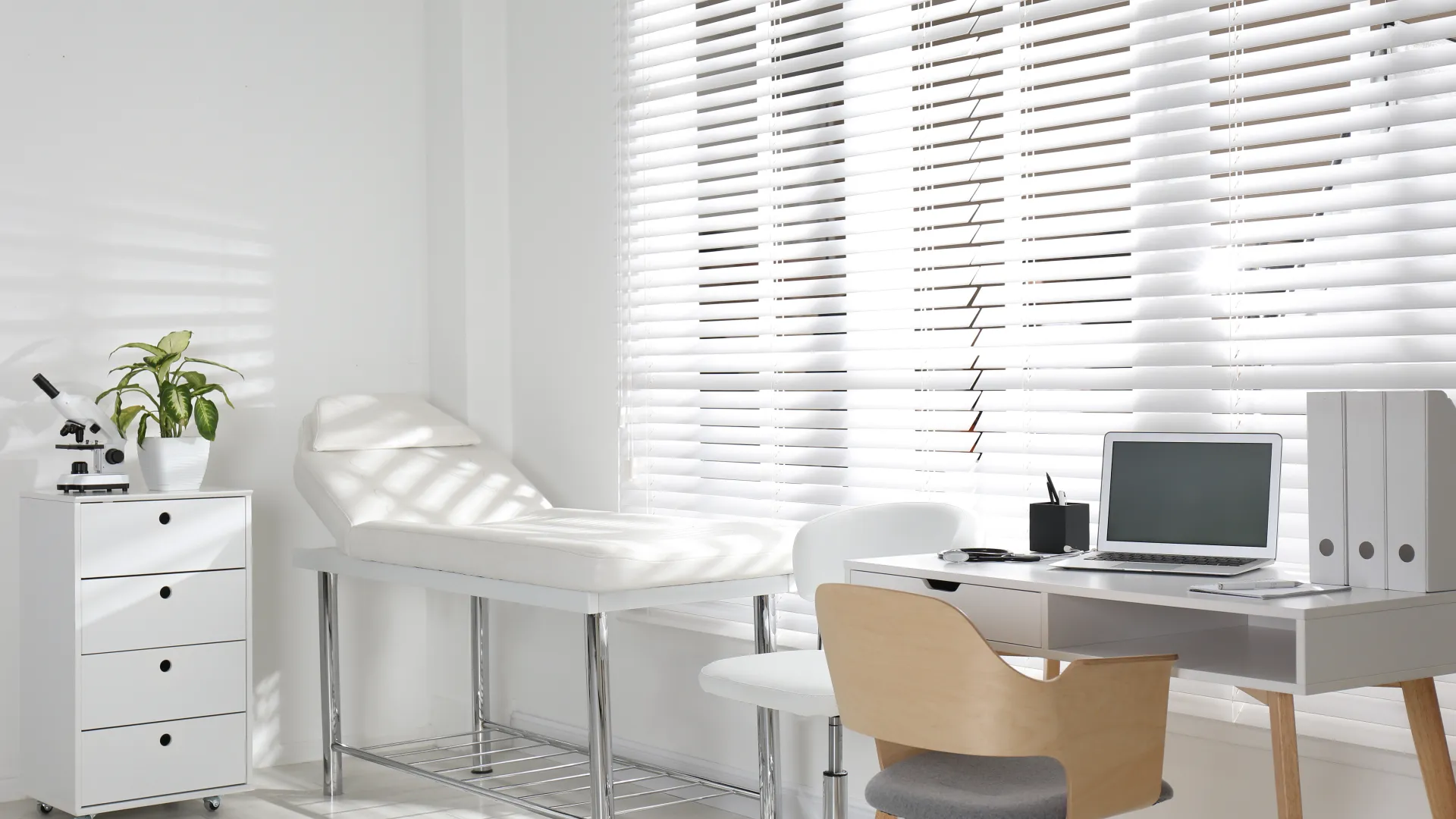 a room with a desk and chairs