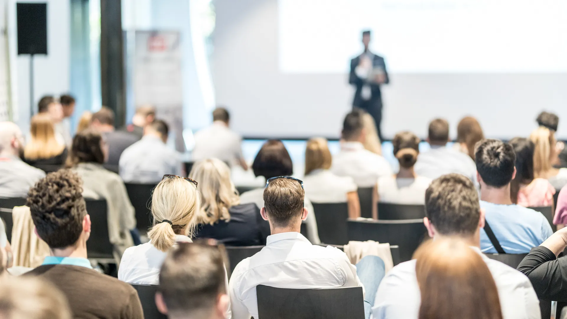 a person standing in front of a group of people