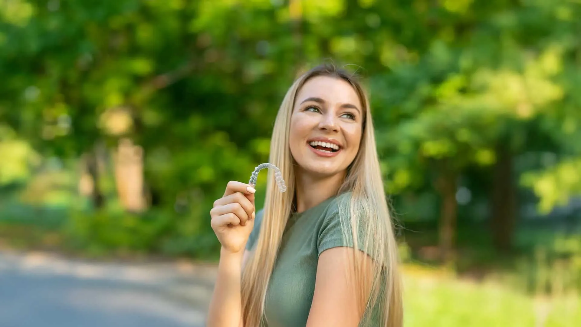 a woman holding a aligner