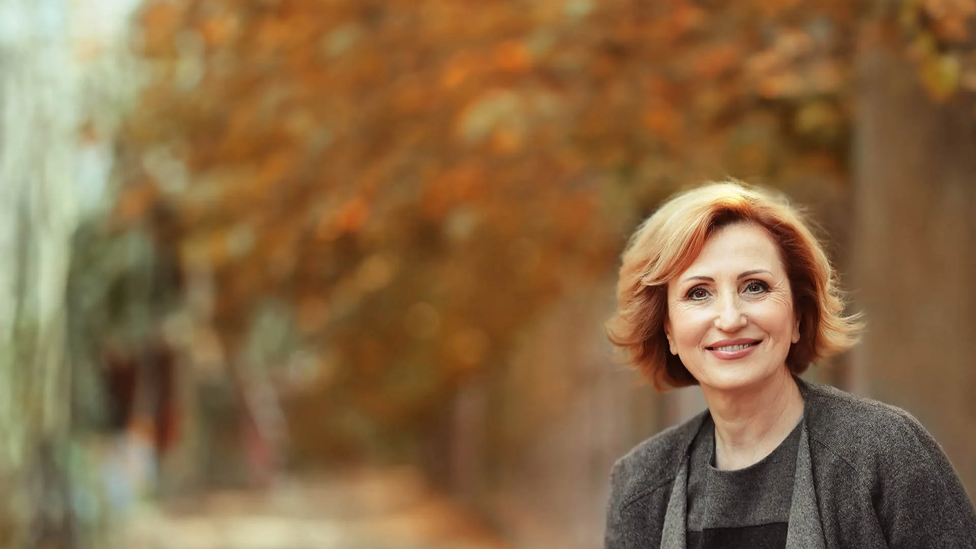 a woman smiling outside