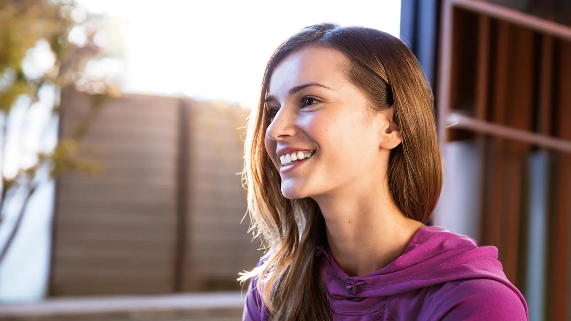 a woman smiling outside