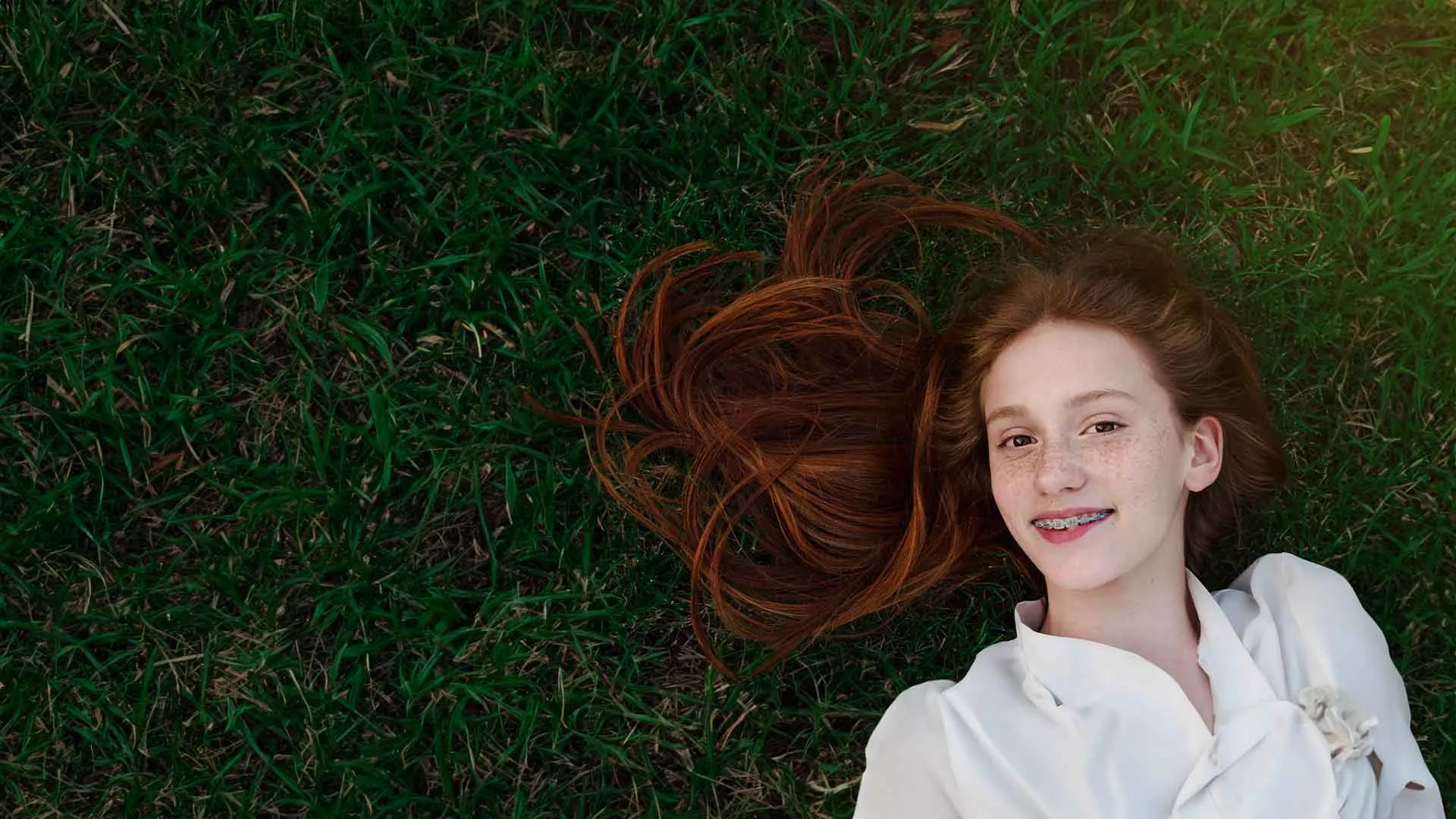 a person lying in the grass