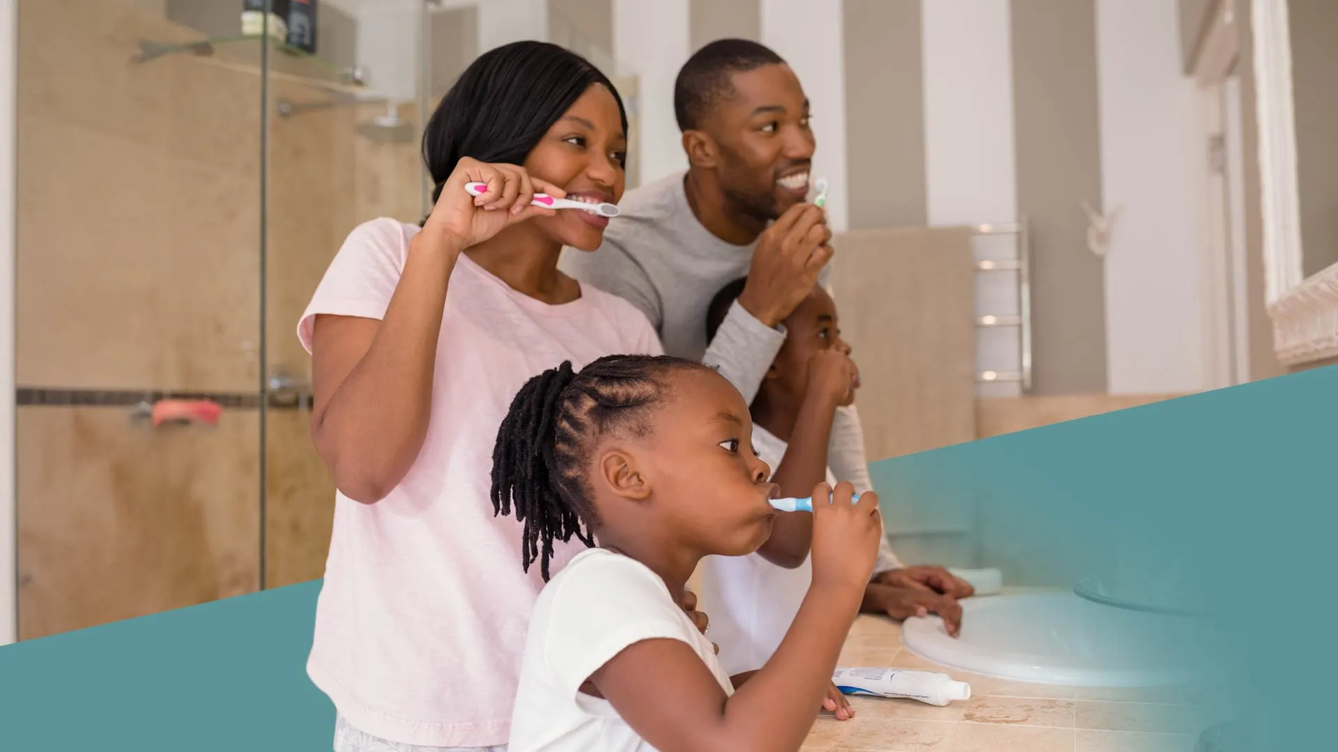 a person brushing a child's teeth