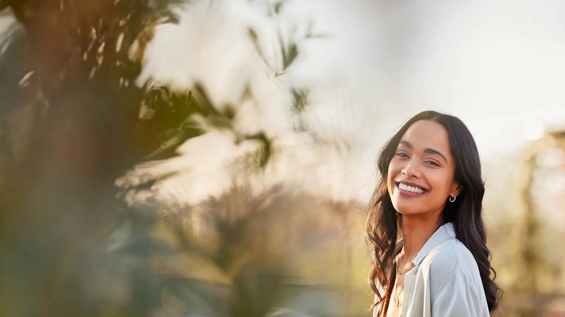 a woman smiling outside