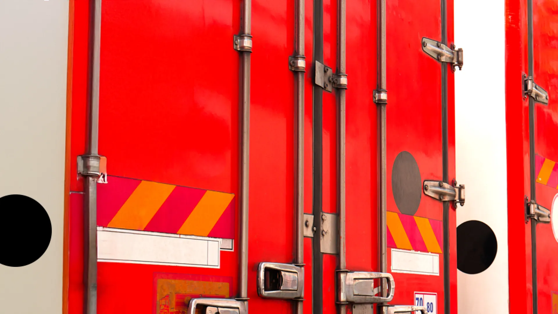 a row of red and white shipping containers