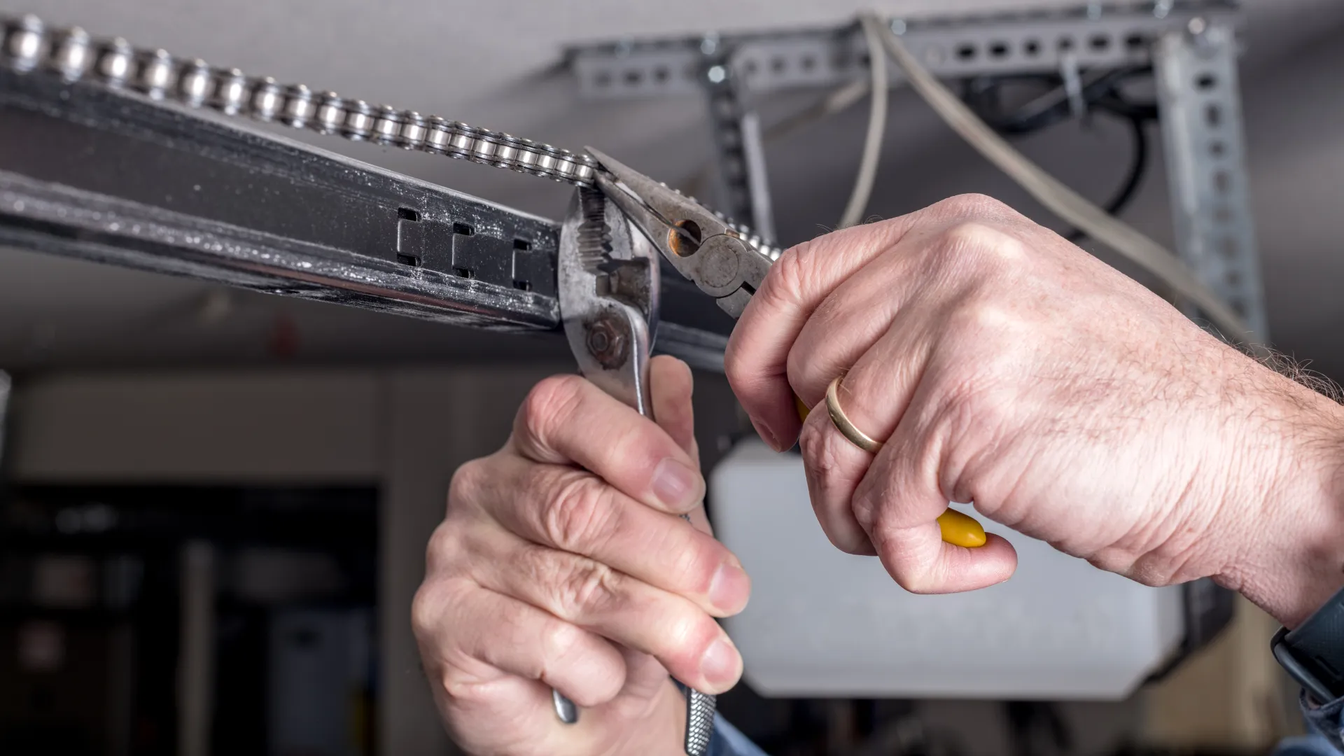 close-up of hands holding a metal piece