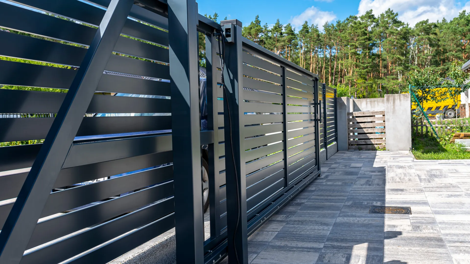 a metal gate with a metal railing