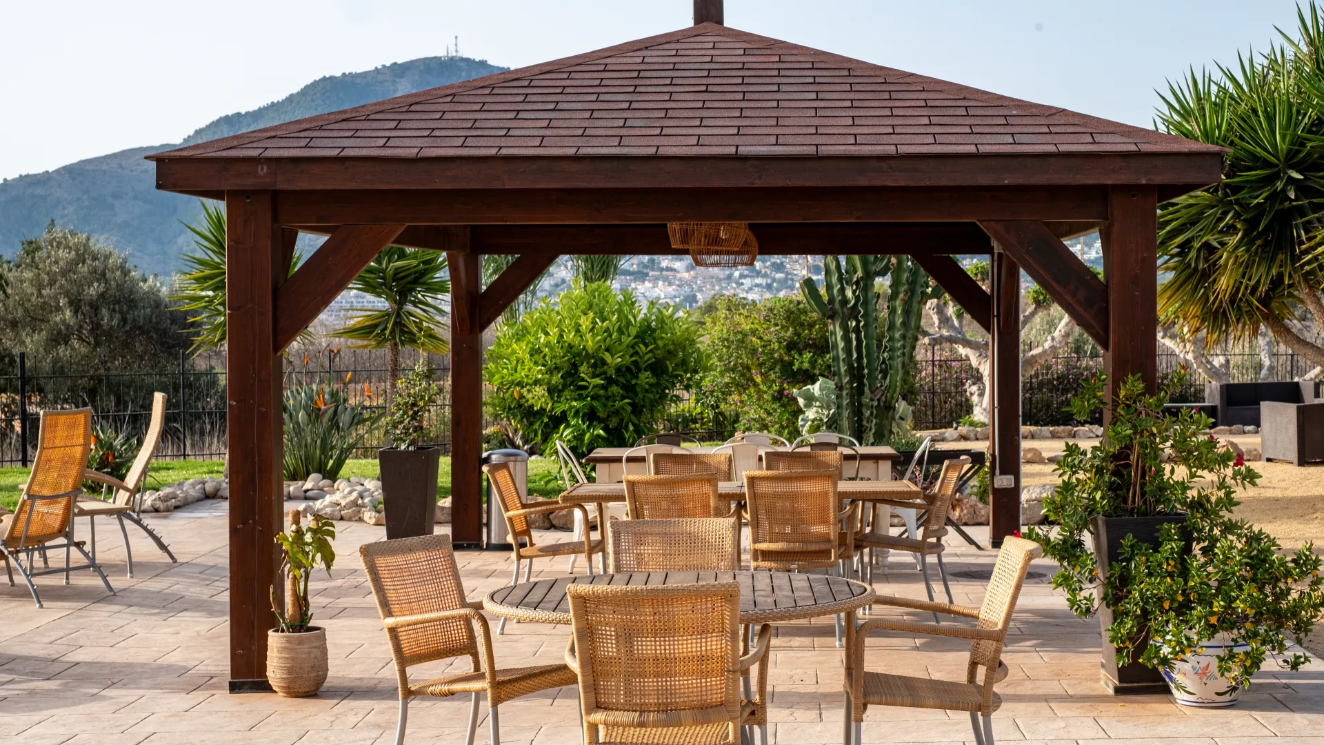 a patio with chairs and tables