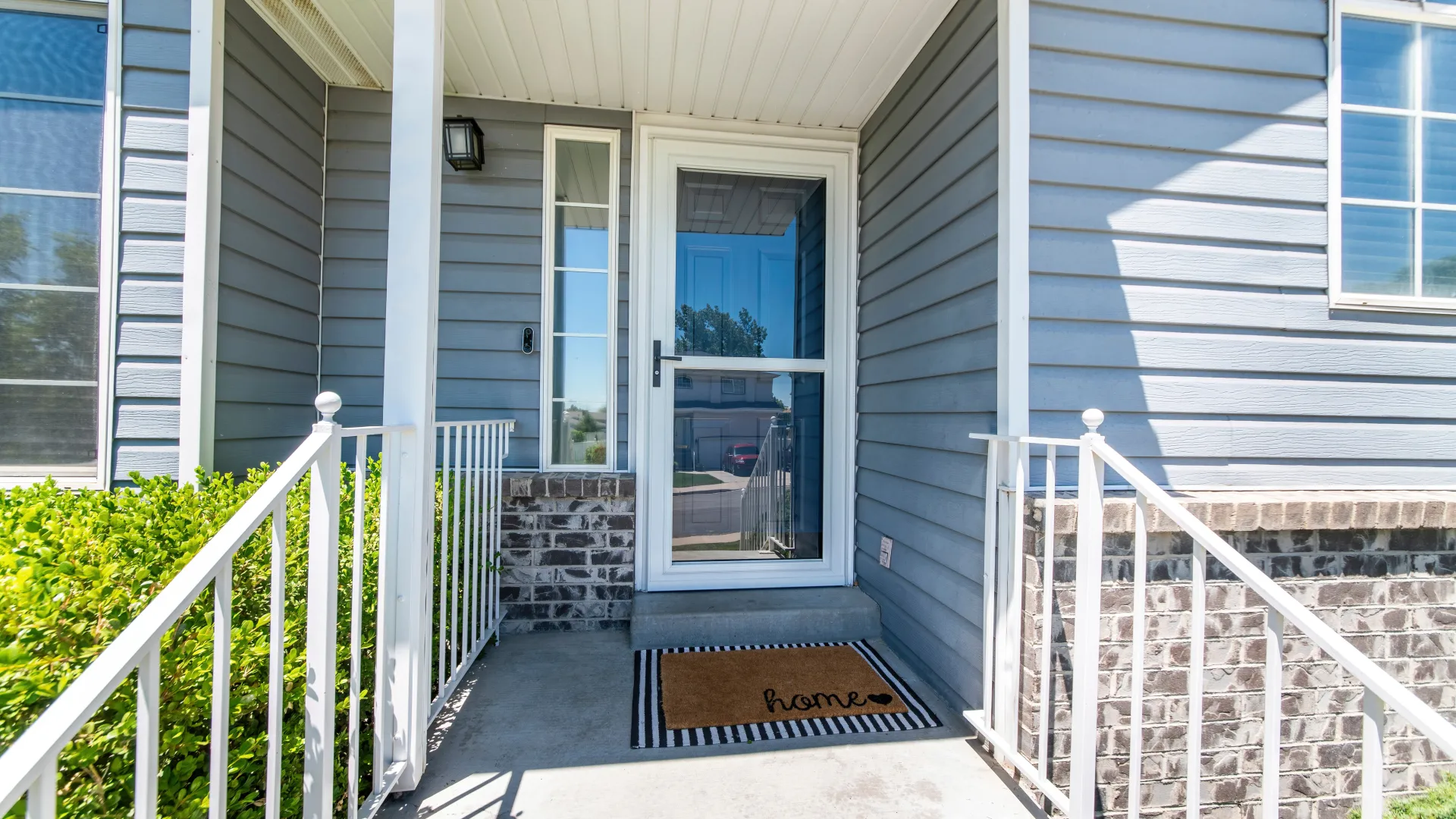 a porch with a railing and a railing