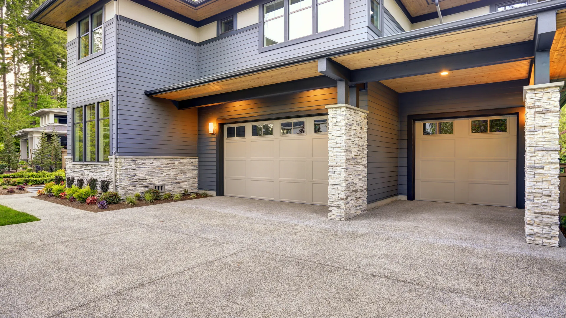 a house with garages and a driveway