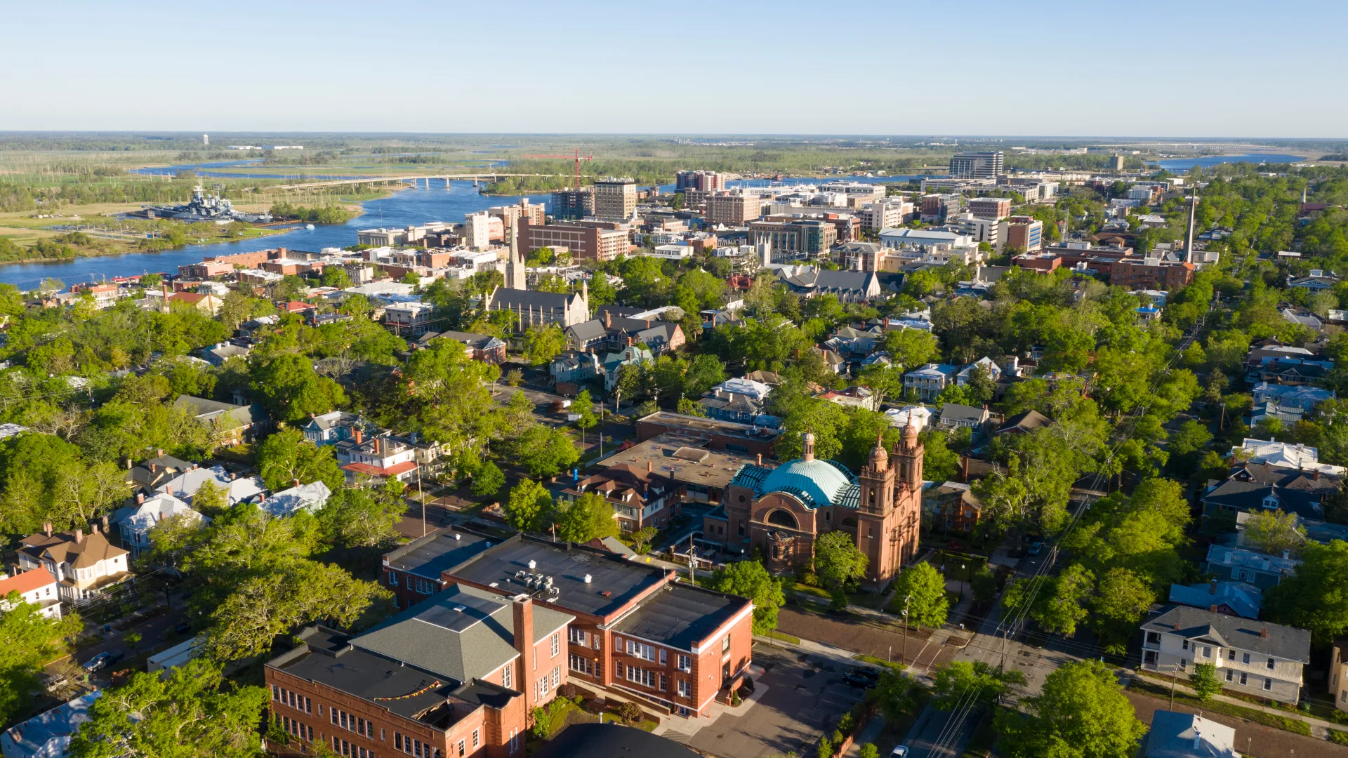 a city with many buildings and trees