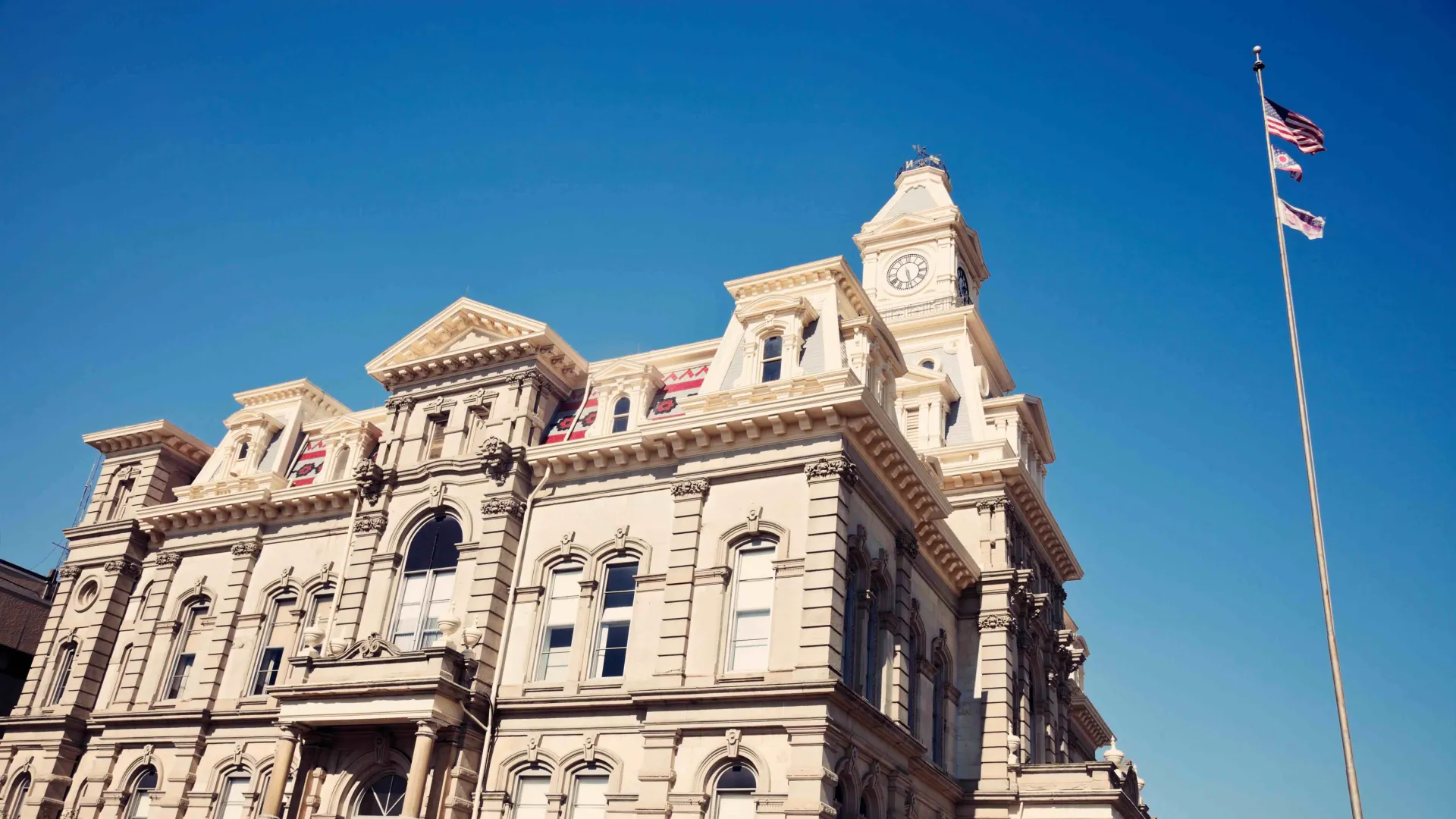 a large building with a flag on top