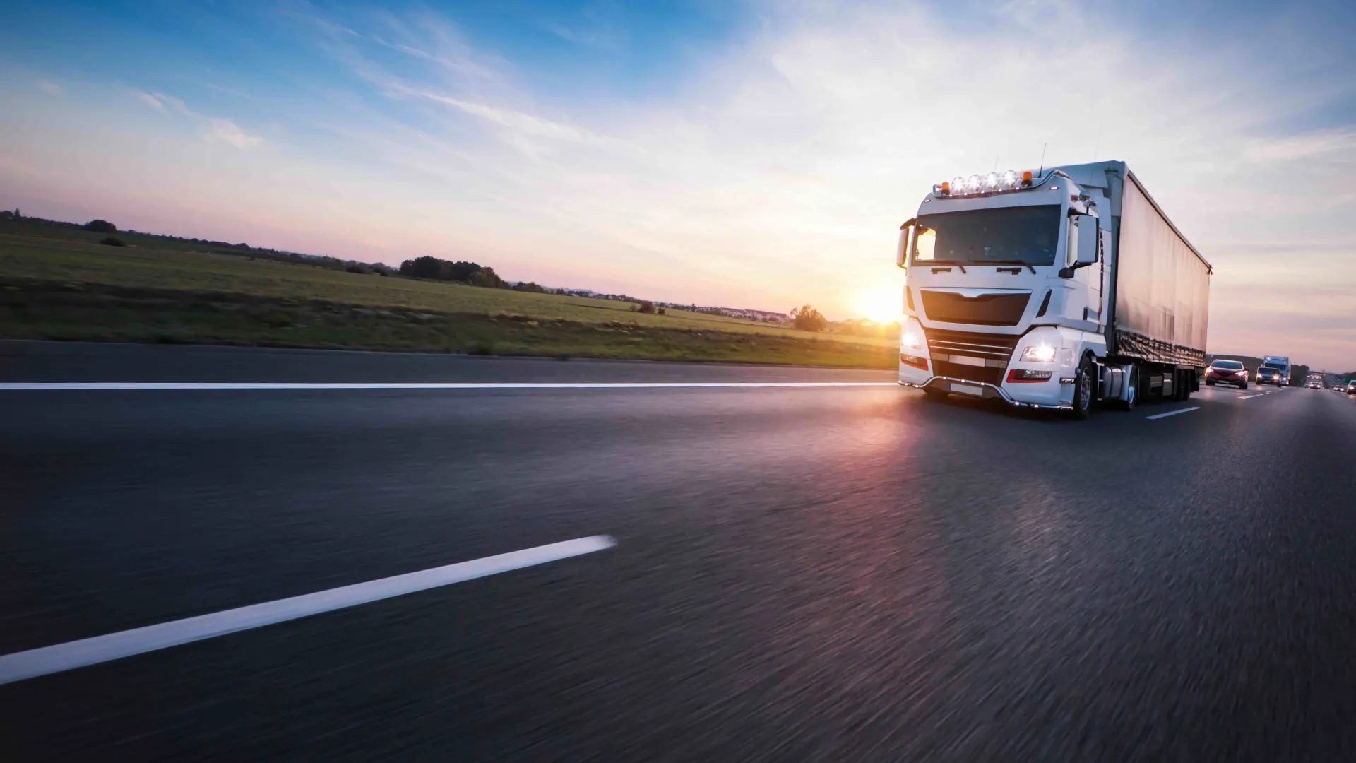 a semi truck driving down the highway