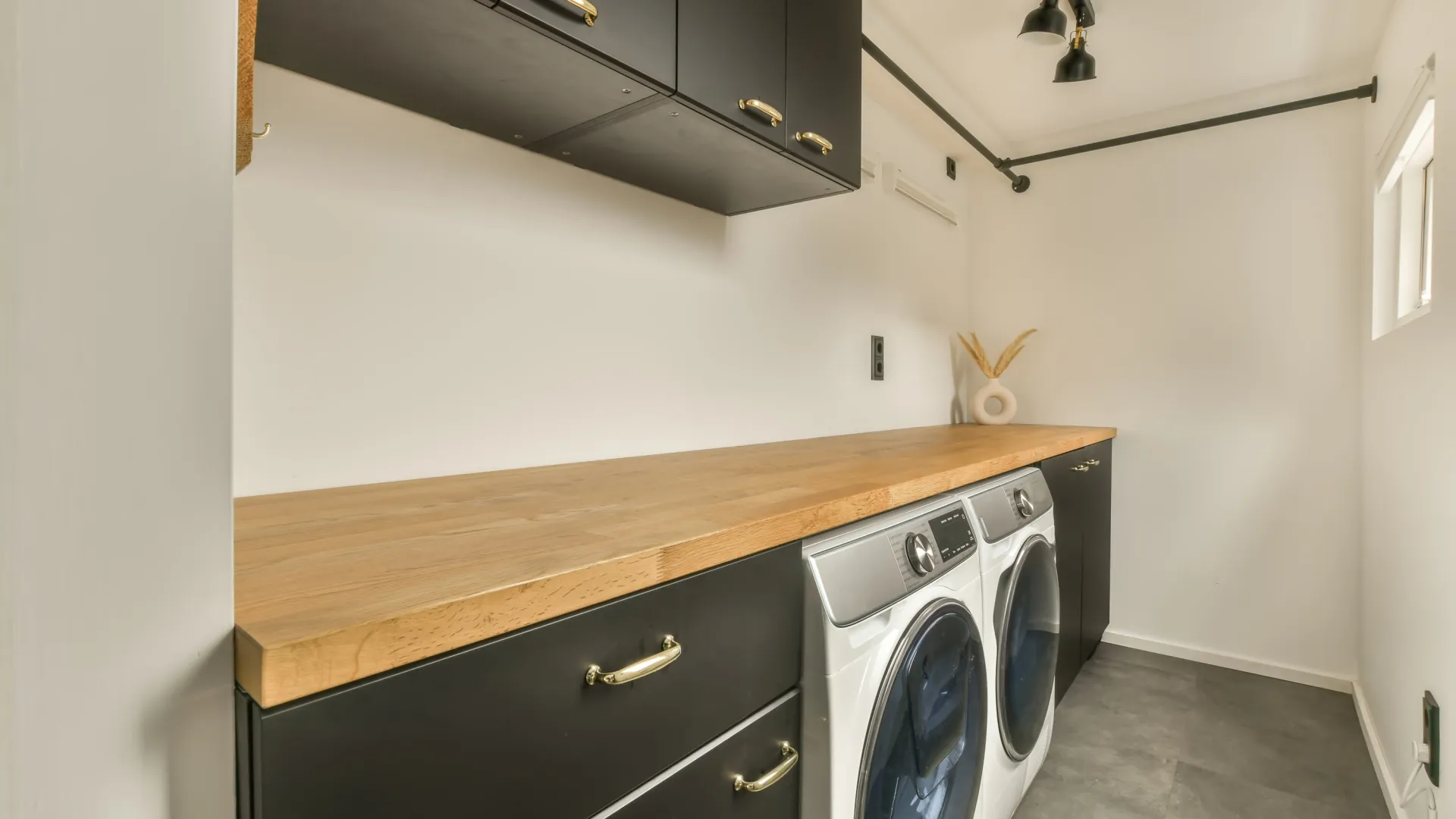 landury room with washer and dryer inside