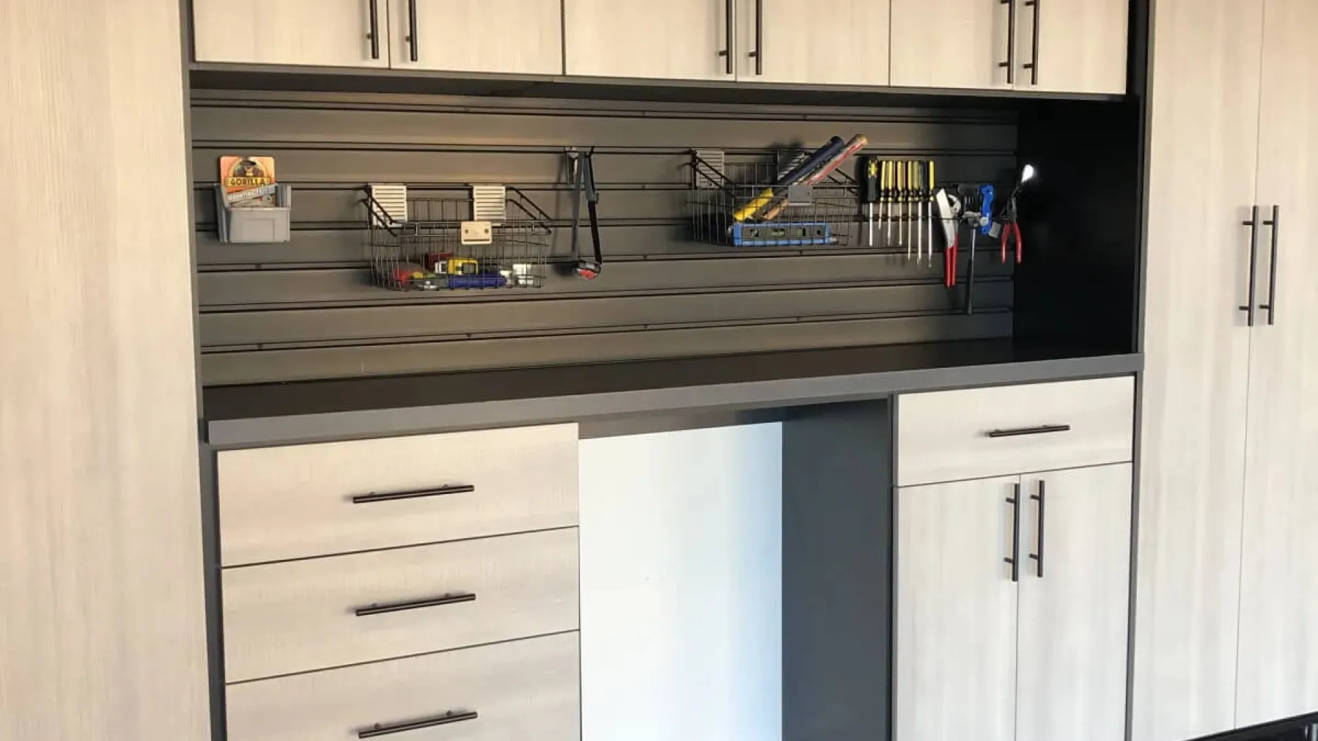 a kitchen with white cabinets