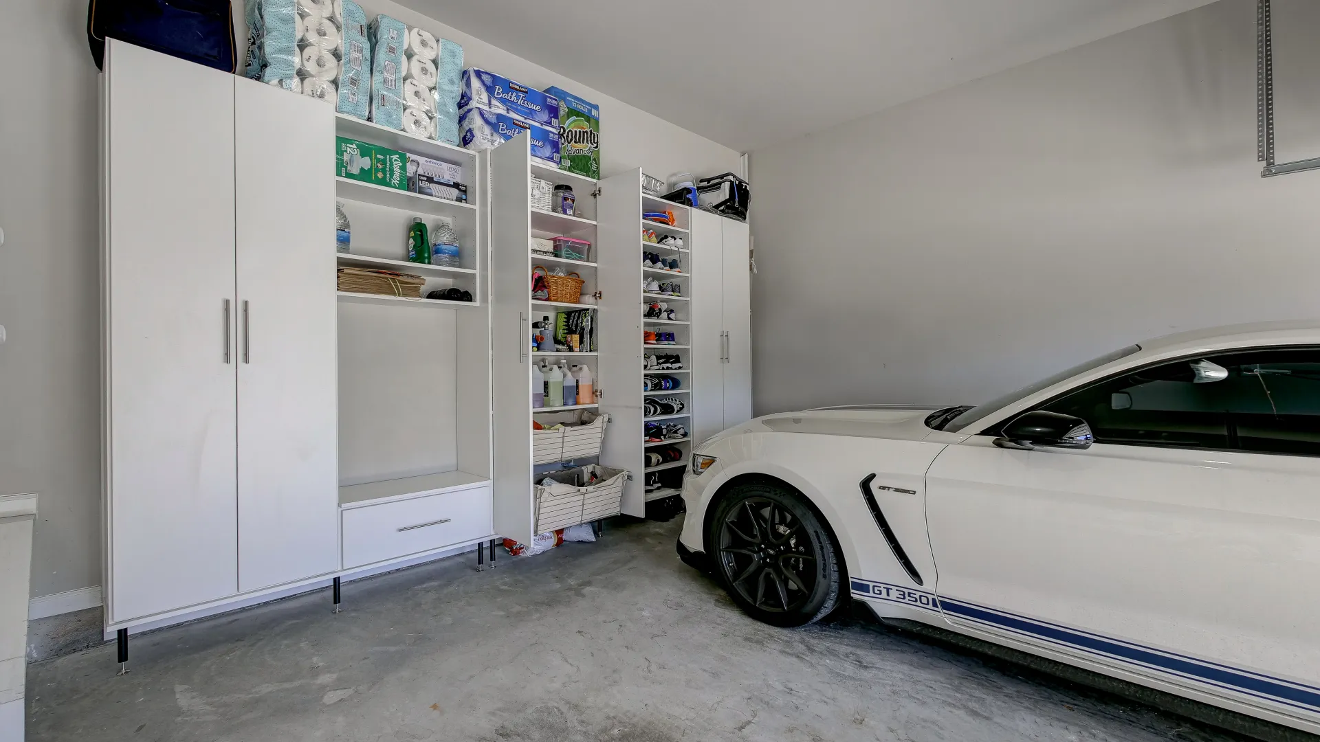 a white car parked in a room