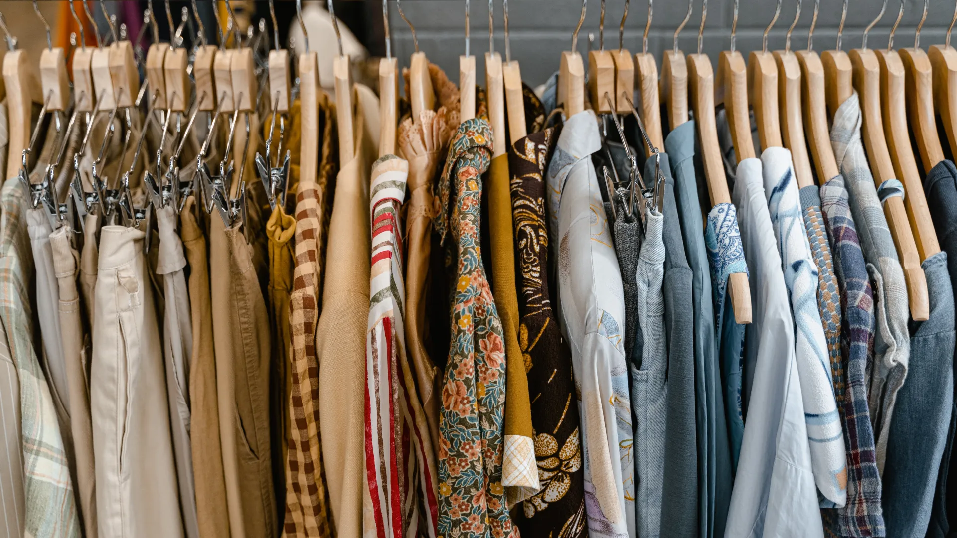 clothes hanging on wooden hangers