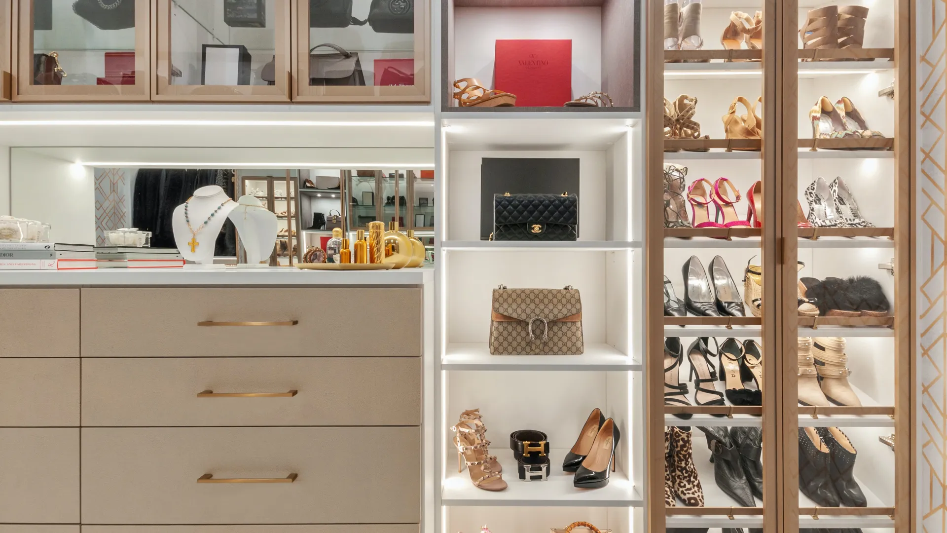 a luxury closet with designer shoes handbags and jewelry