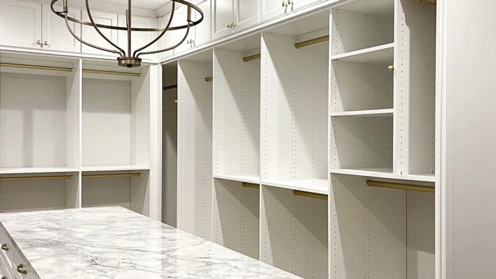 a kitchen with white cabinets