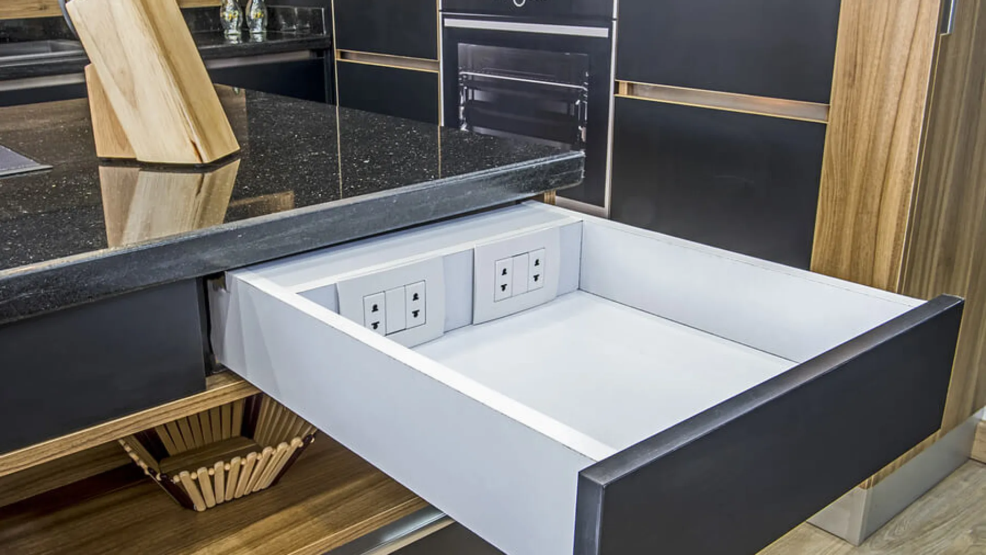 a kitchen with a sink and a wooden bench