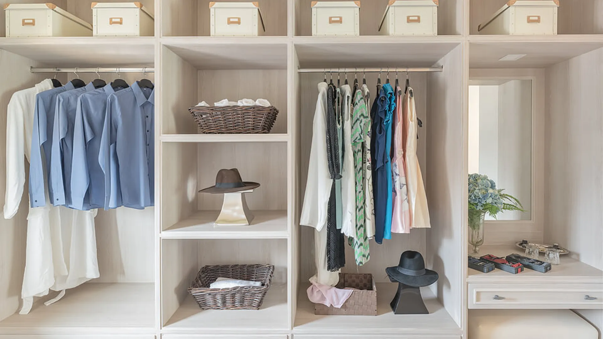 a closet with clothes and hats