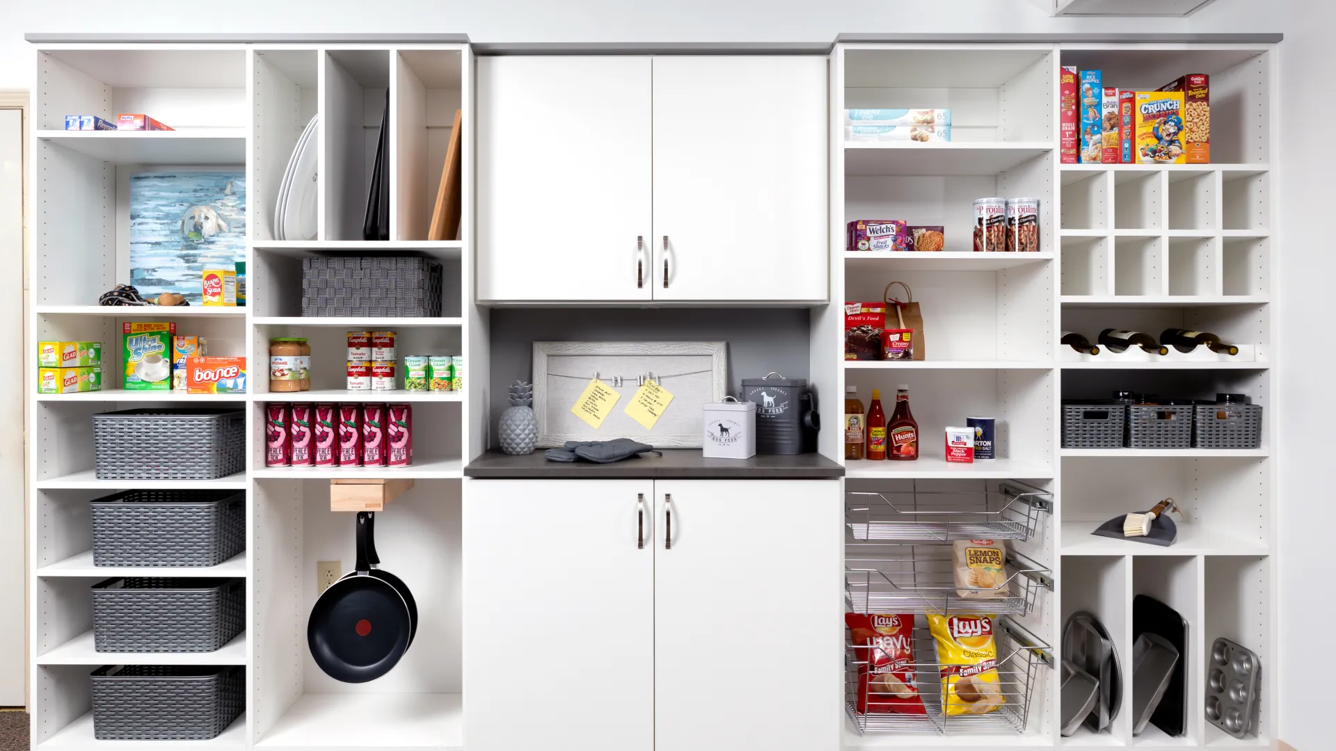 a white kitchen with white cabinets