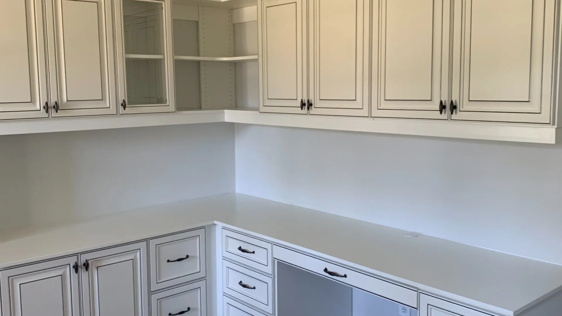 a kitchen with white cabinets