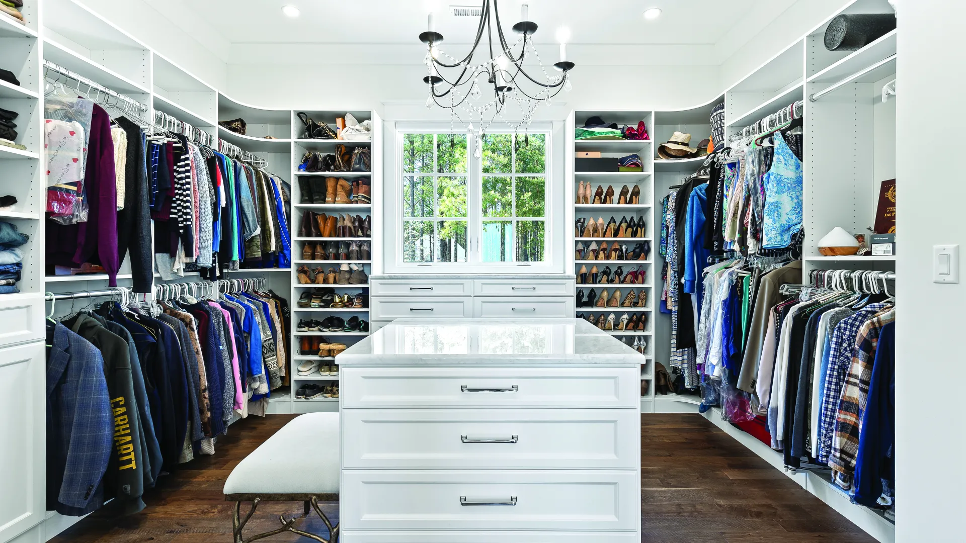 a room with a white dresser and a white dresser with a white cabinet and a window with a