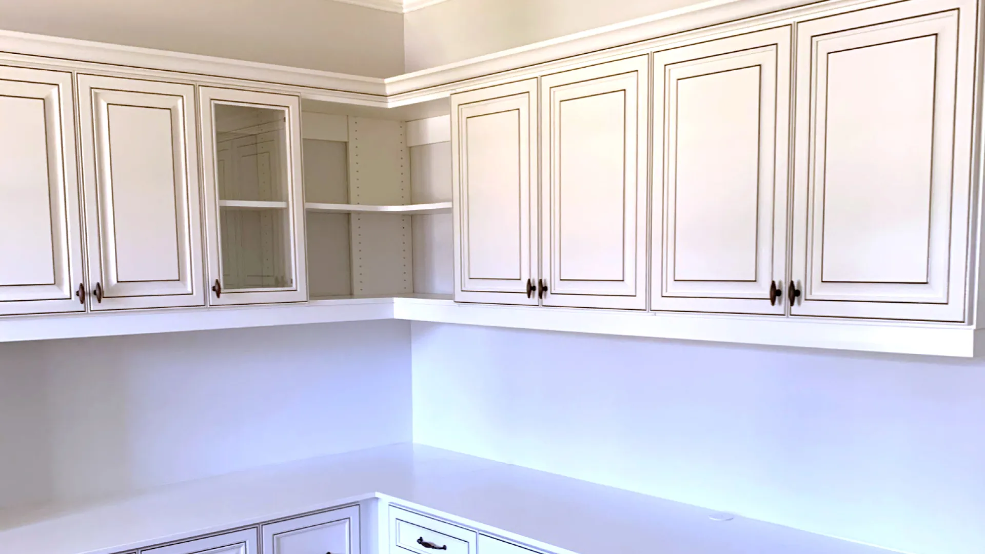 a kitchen with white cabinets