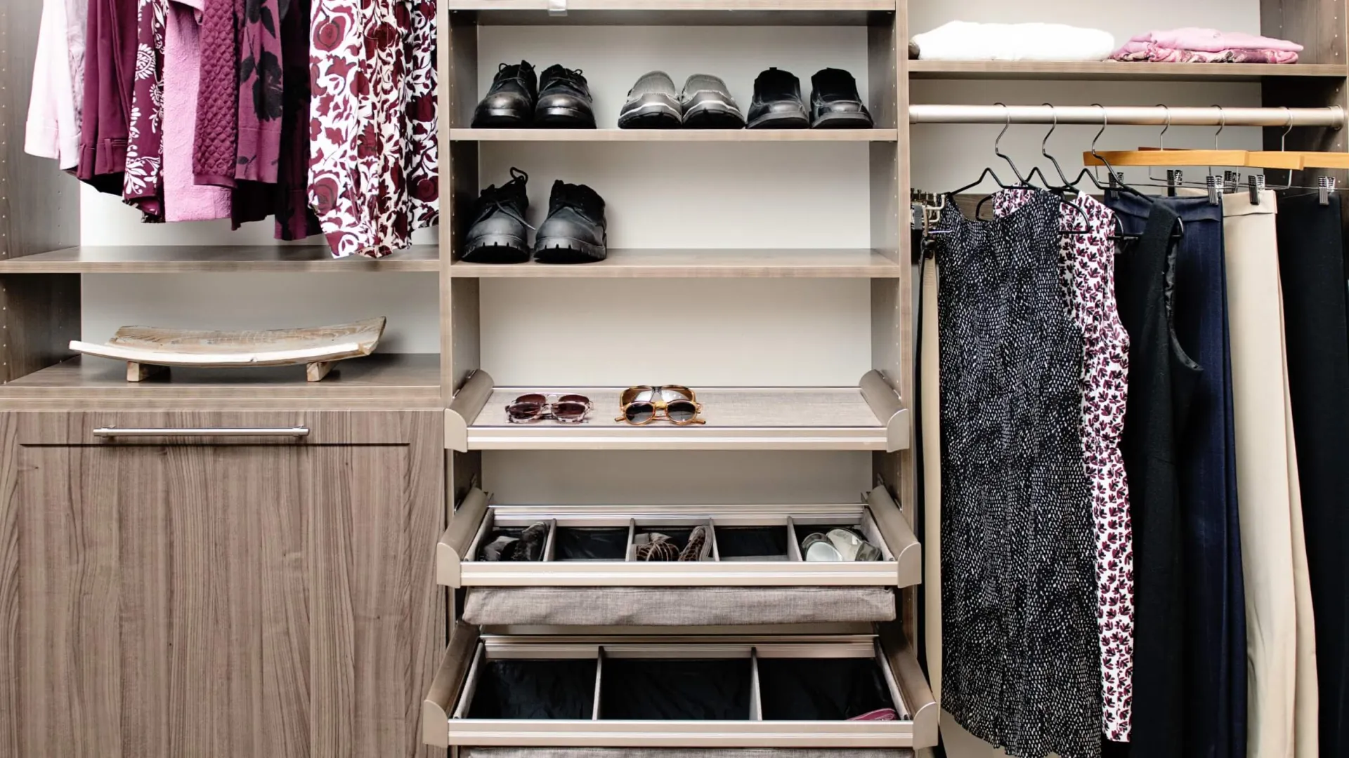 a closet with clothes and shoes