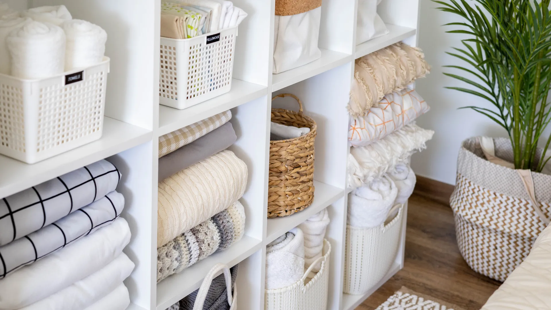 a custom storage design in white with baskets