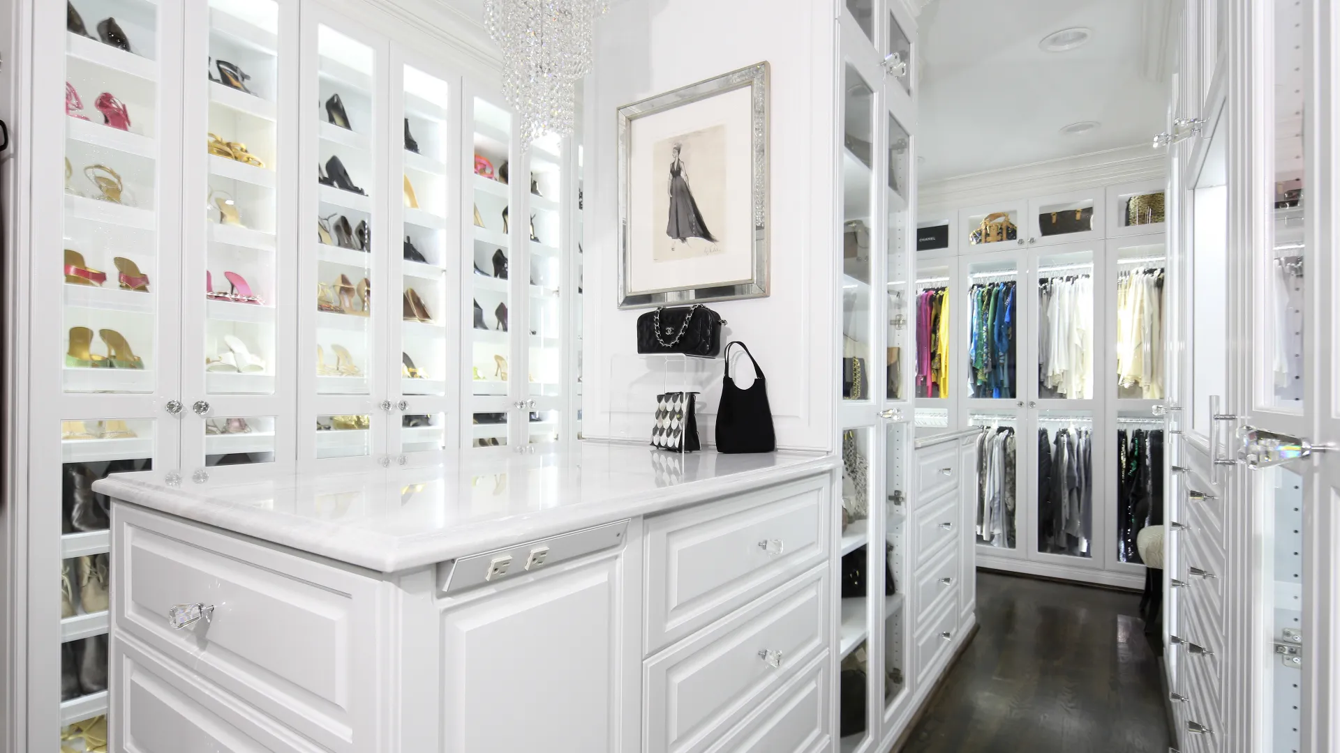 a white master closet with white drawers