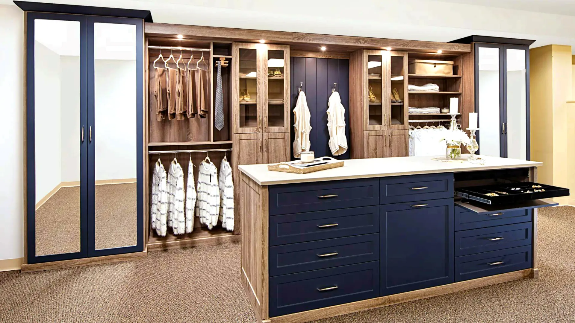 a bedroom closet with a large blue island