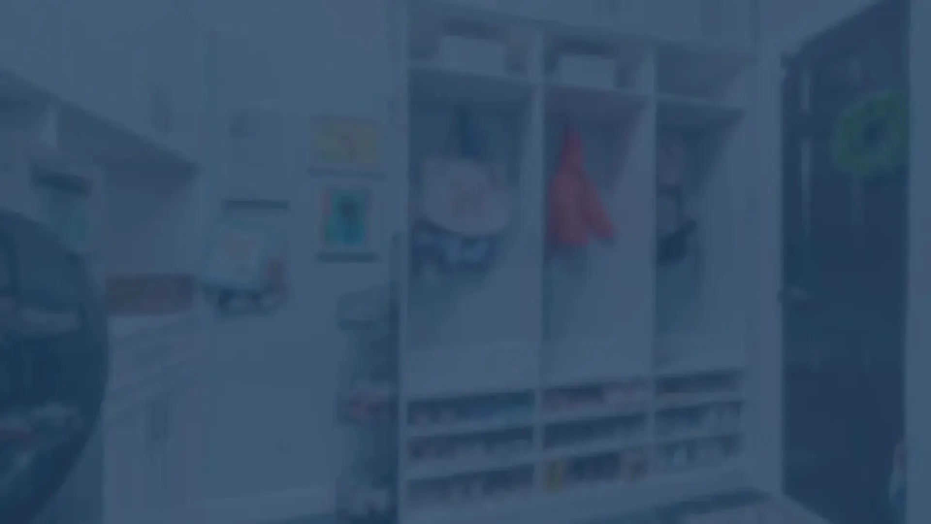 Organized mudroom with cubbies, hooks for coats, and built-in shoe storage by the door