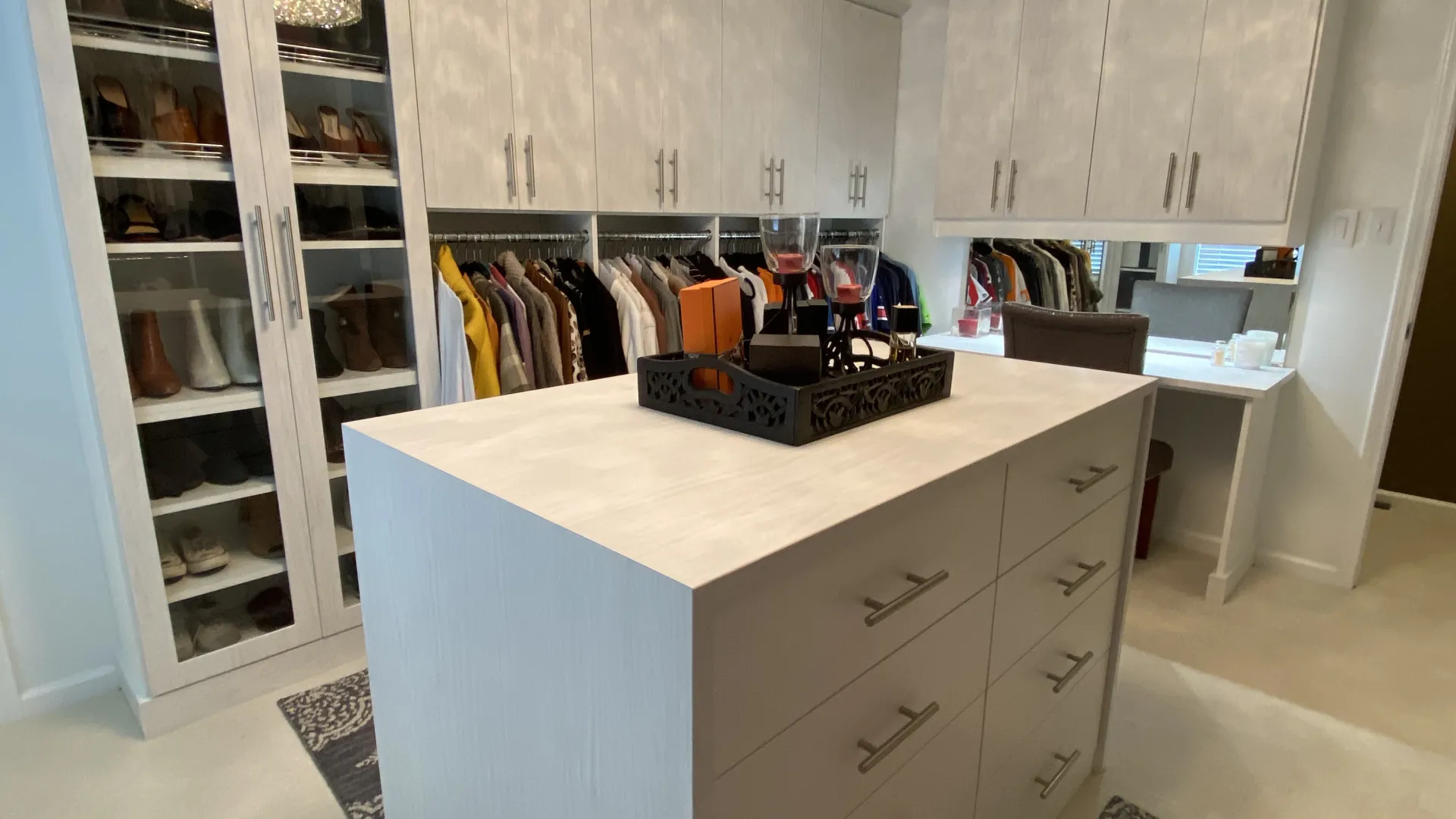 a kitchen with white cabinets