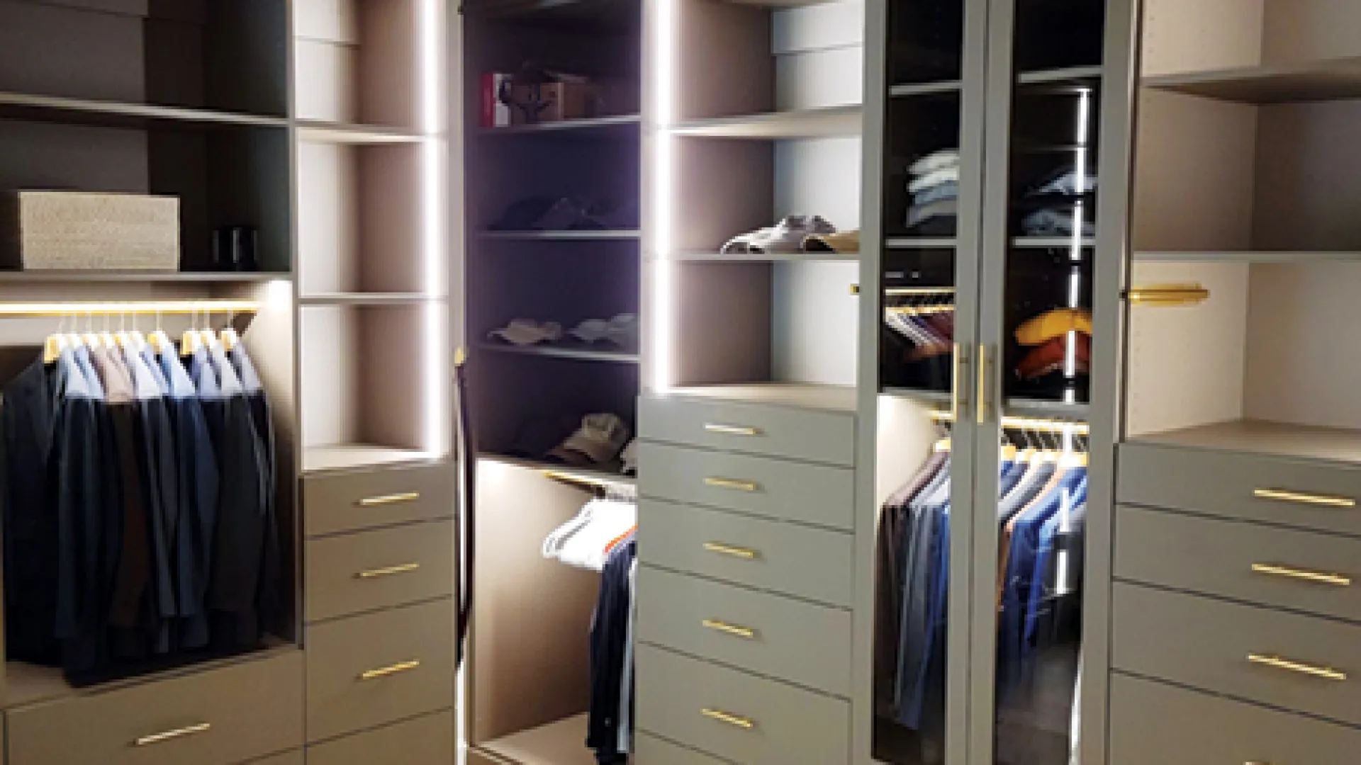 a closet with white cabinets