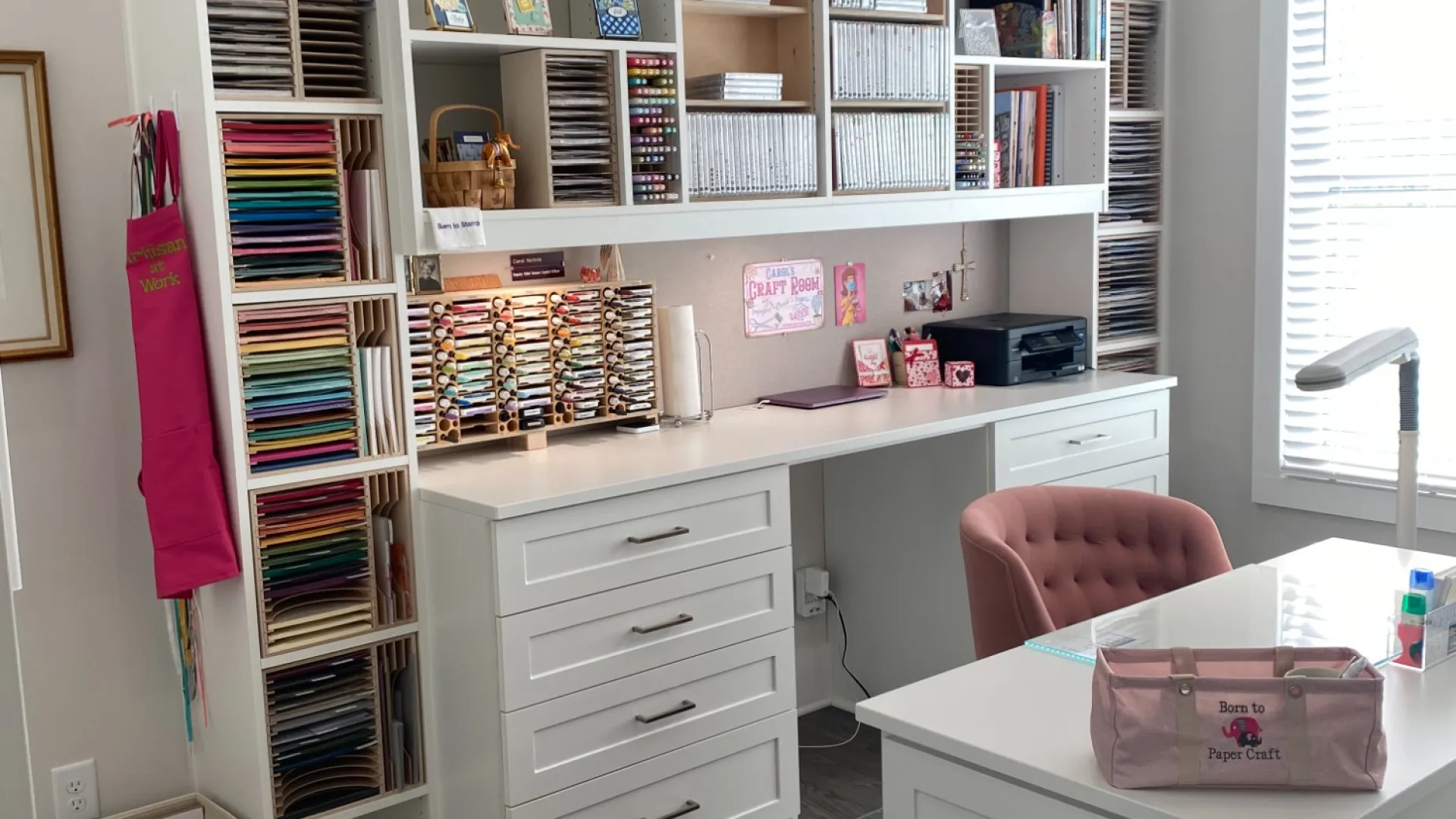 a room with shelves and a desk