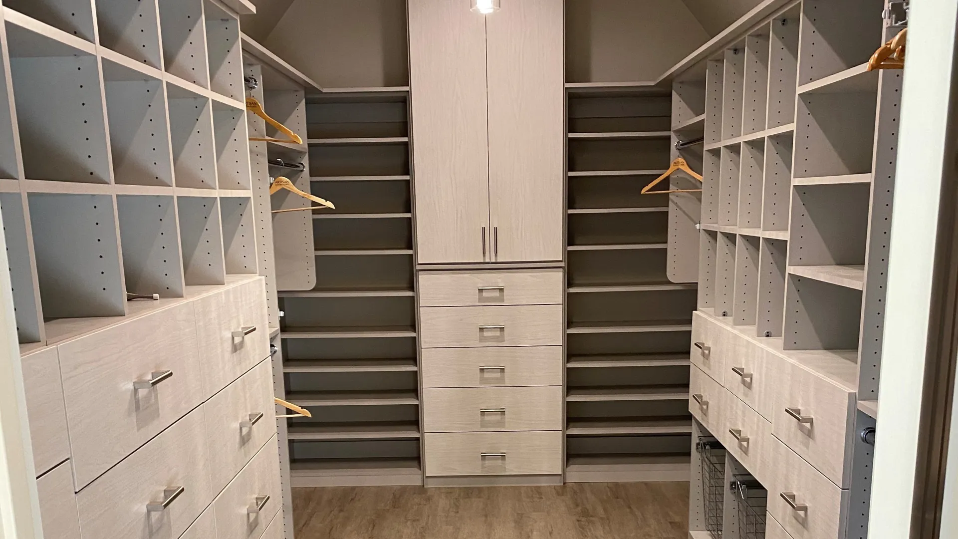 a room with shelves and a wood floor