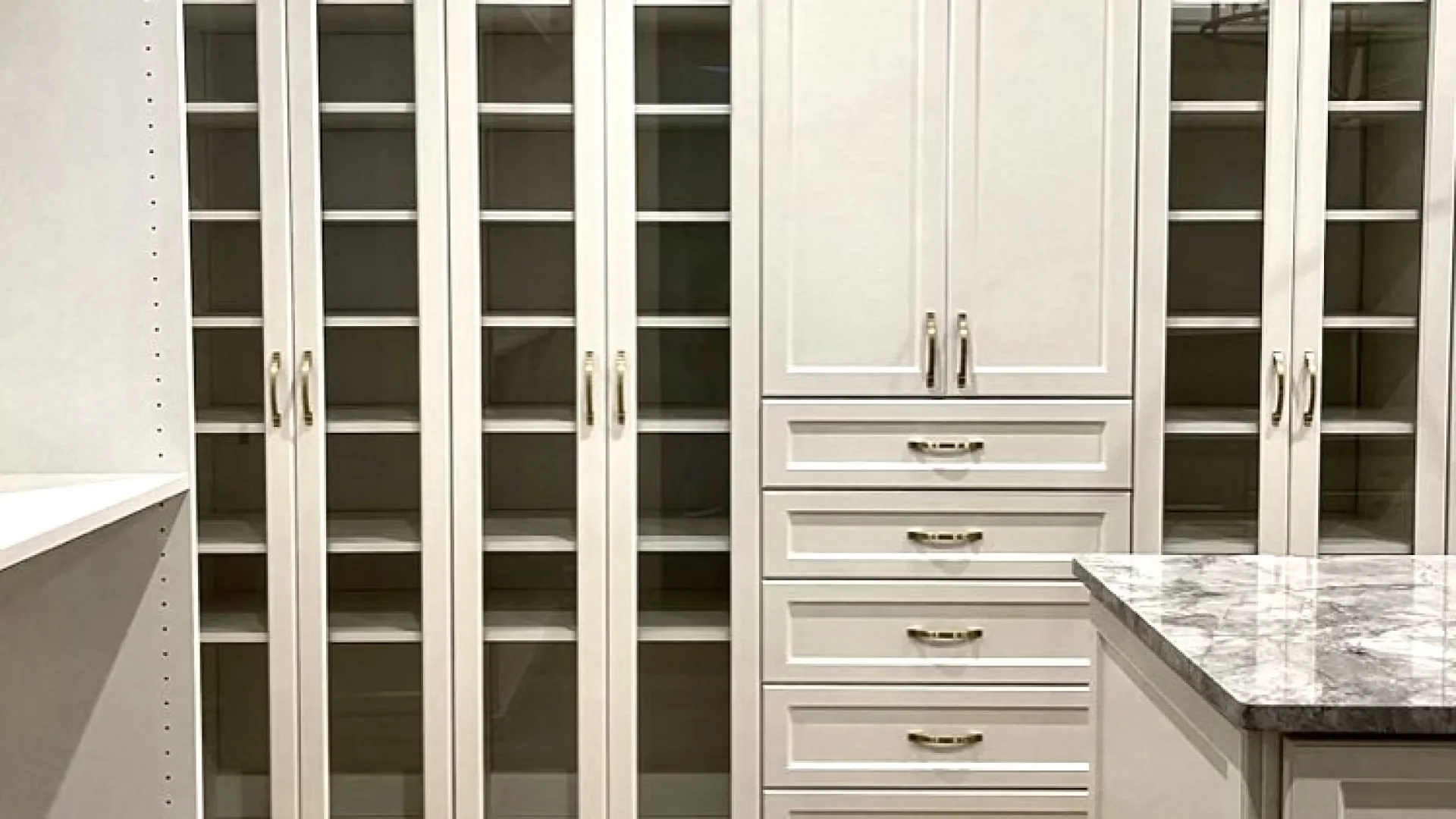 a white kitchen with white cabinets