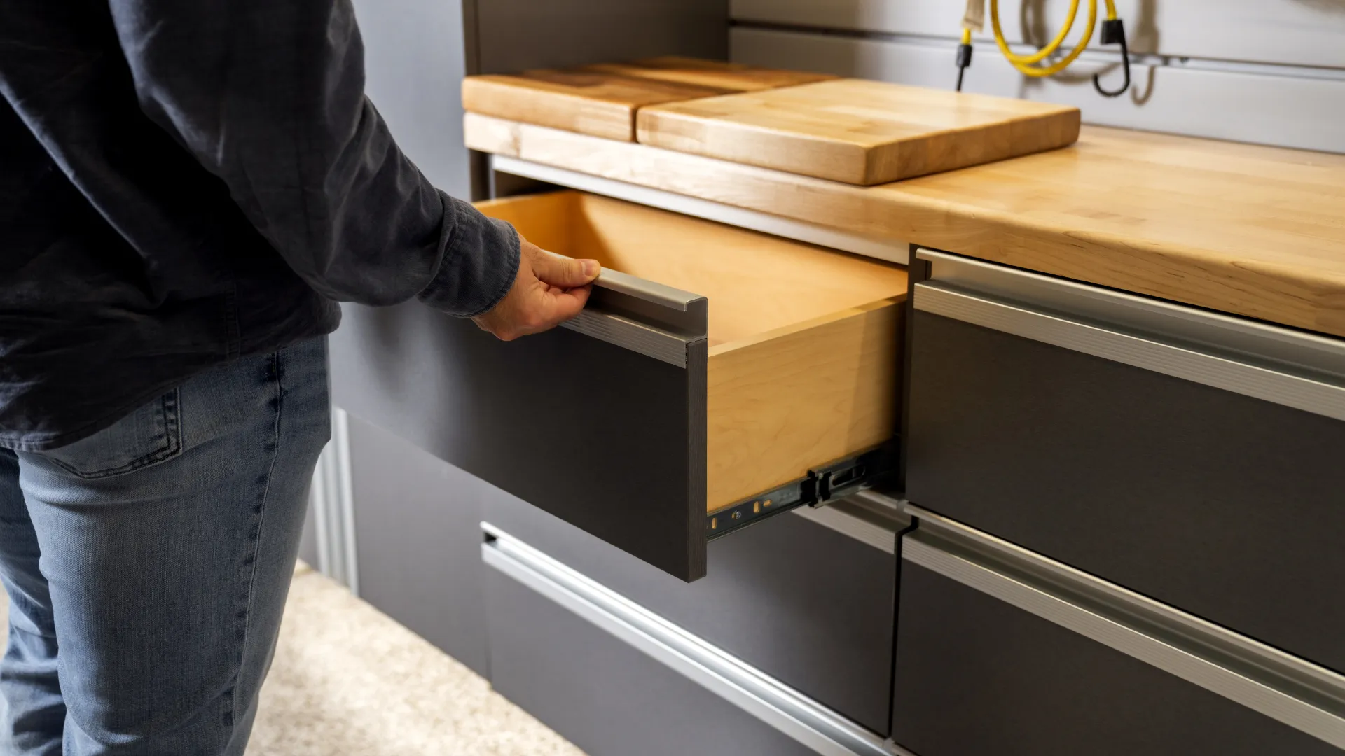 a person standing next to a cabinet