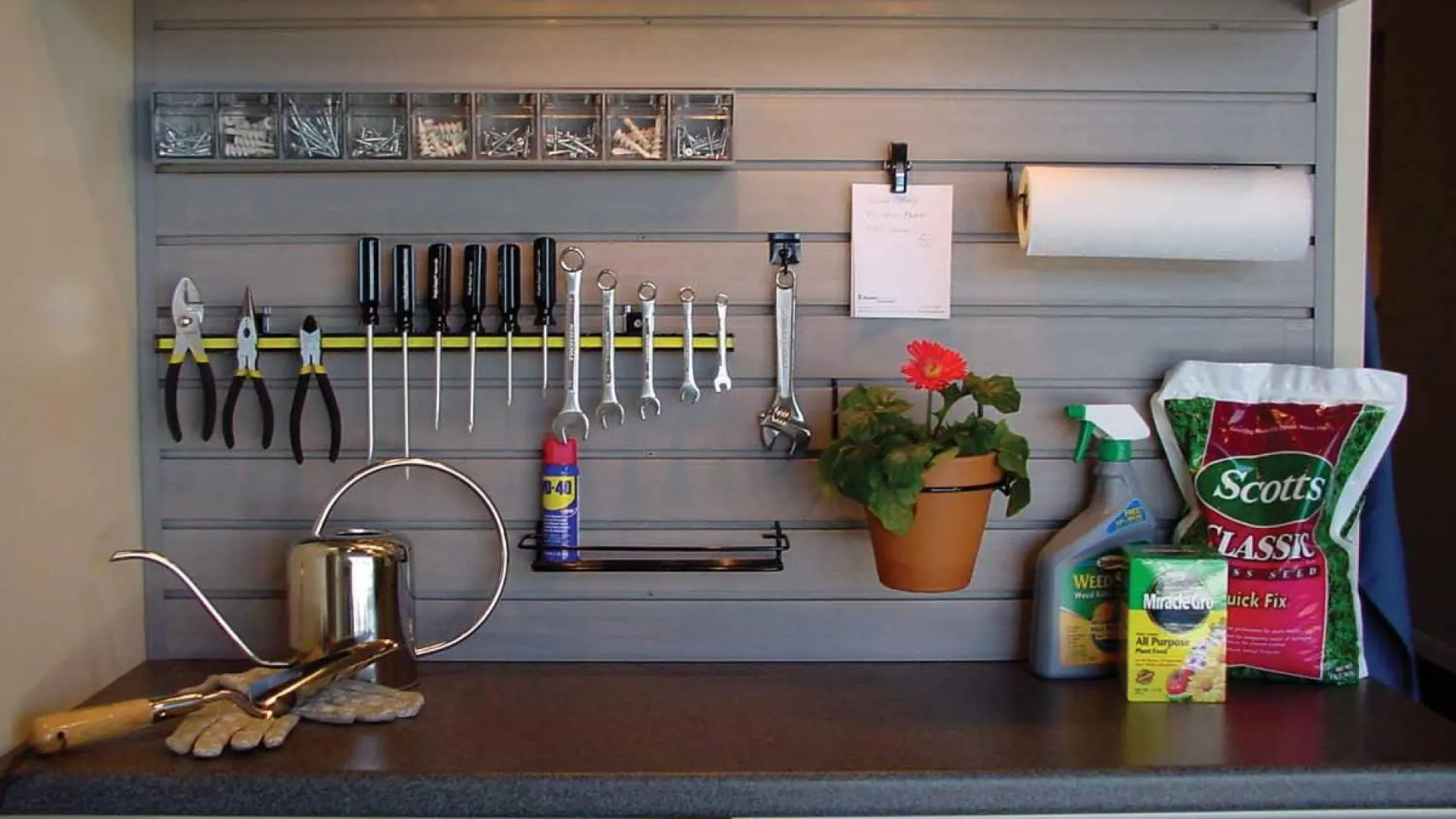 a kitchen counter with a sink and a plant