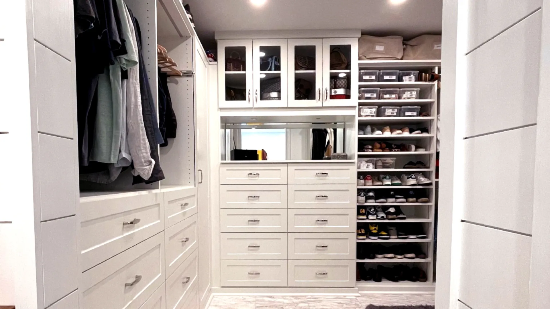 a closet with white cabinets